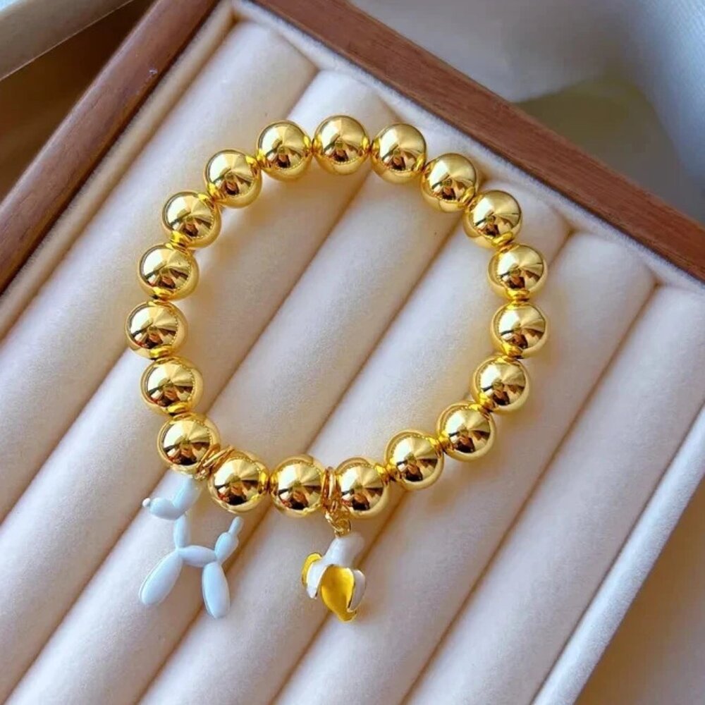 18K gold-plated copper bracelets with banana and  dog charms.